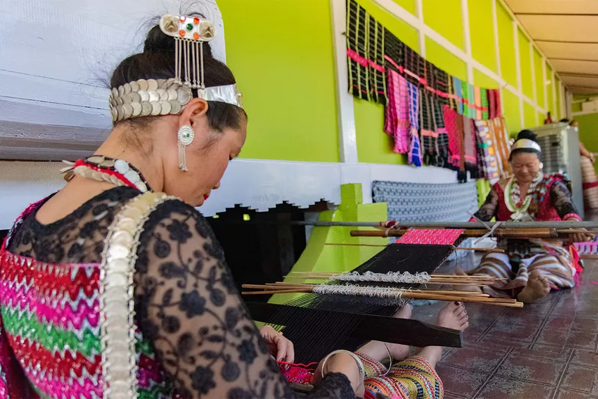 Idu Mishmi woman weaving traditional coat on backstrap loom — RIWATCH Museum